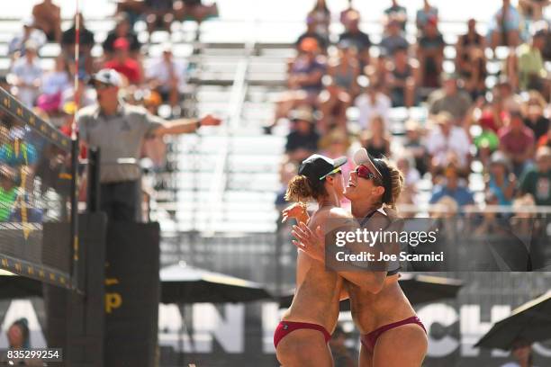 April Ross and Lauren Fendrick react to a point during their round 2 match at the AVP Manhattan Beach Open - Day 2 on August 18, 2017 in Manhattan...