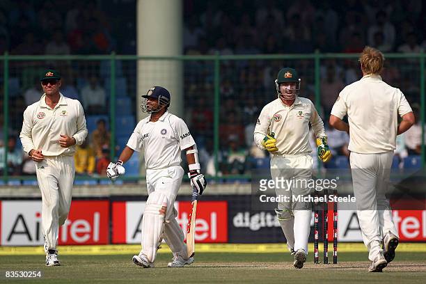 Sachin Tendulkar walks after being caught by Matthew Hayden off the bowling of Cameron White during day five of the Third Test match between India...