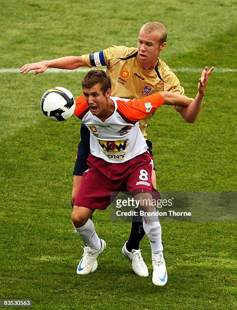 Michael Angus of the Roar competes with Taylor Regan of the Jets during the round six National Youth League match between the Newcastle Jets and the...
