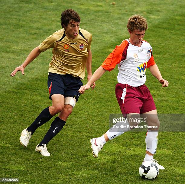 Joel Witherdin of the Jets attempts to tackle the Roar forward line during the round six National Youth League match between the Newcastle Jets and...