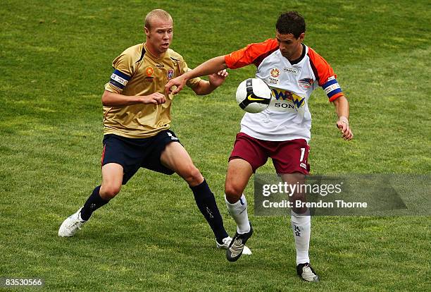 Joshua McVey of the Roar competes with Taylor Regan of the Jets during the round six National Youth League match between the Newcastle Jets and the...