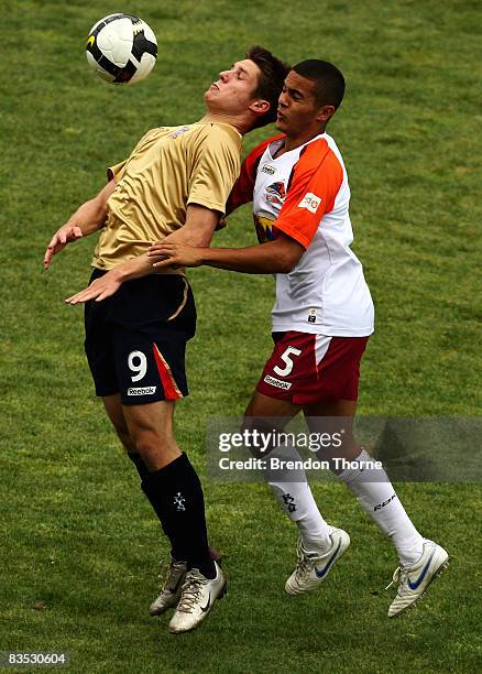 Brodie Mooy of the Jets competes with Bradley McDonald of the Roar during the round six National Youth League match between the Newcastle Jets and...