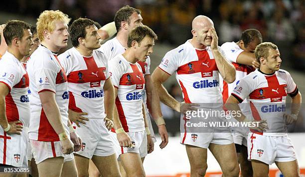 England players react after Australian scores another try in their Rugby League World Cup match at the Docklands Stadium in Melbourne on November 2,...