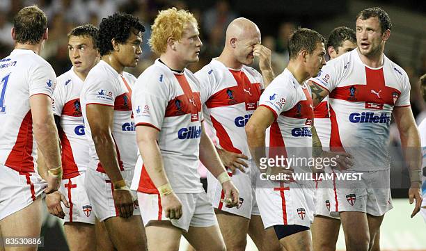 England players react after Australia scores another try in their Rugby League World Cup match at the Docklands Stadium in Melbourne on November 2,...