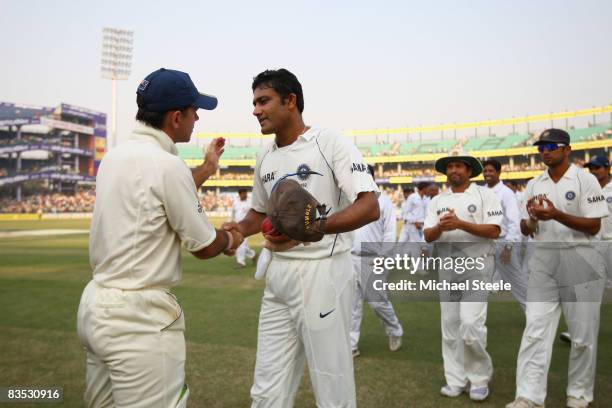 Anil Kumble of India shakes hands with Australia captain Ricky Ponting as the match ended in a draw and Kumble had earlier announced his retirement...