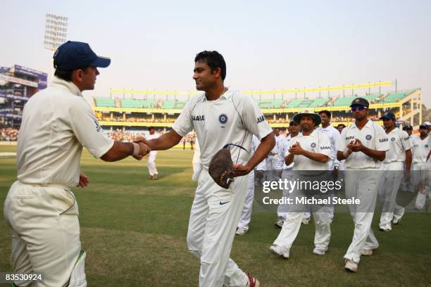 Anil Kumble of India shakes hands with Australia captain Ricky Ponting as the match ended in a draw and Kumble had earlier announced his retirement...