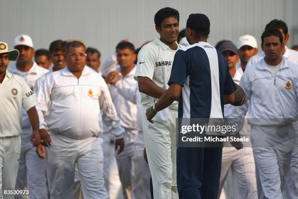 Indian captain Anil Kumble is hugged by Harbhajan Singh after announcing his retirement from Test cricket during day five of the Third Test match...