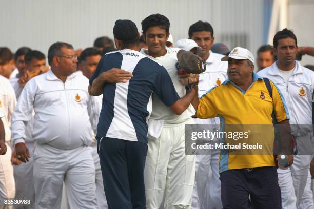Indian captain Anil Kumble is hugged by Harbhajan Singh after announcing his retirement from Test cricket during day five of the Third Test match...