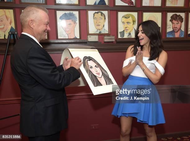 Sardi's owner Max Klimavicius and actress Ana Villafae attend her caricature unveiling at Sardi's on August 18, 2017 in New York City.