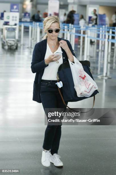 Reese Witherspoon is seen at JFK on August 18, 2017 in New York City.