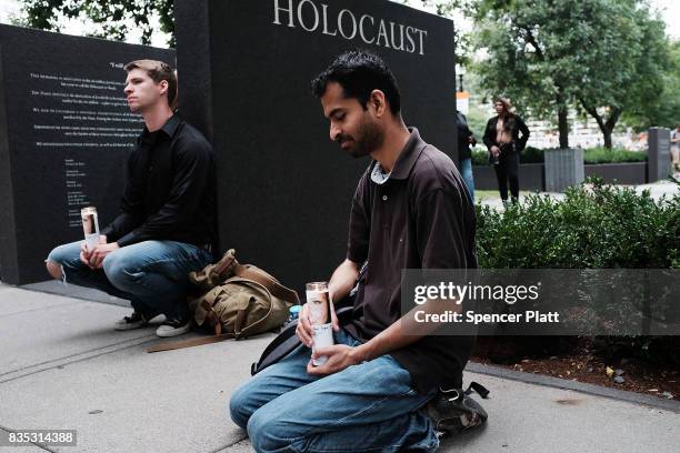 Small group attends a vigil and march at the New England Holocaust Memorial to denounce hate groups before a controversial rally tomorrow on August...