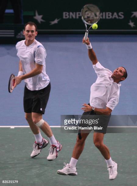 Jeff Coetzee of South Africa plays a return with team mate Wesley Moodie of South Africa during their doubles final against Jonas Bjorkman of Sweden...