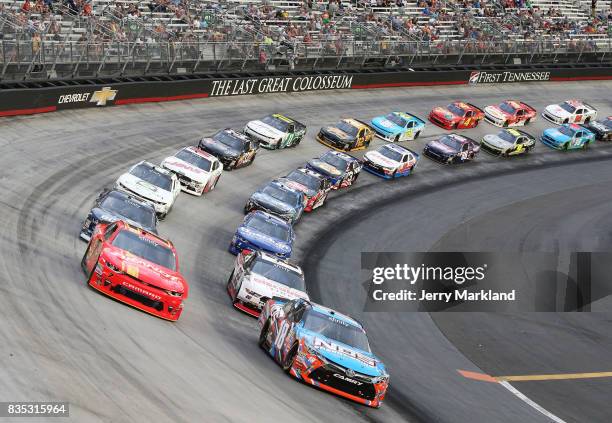 Kyle Busch, driver of the NOS Rowdy Toyota, leads a pack of cars during the NASCAR XFINITY Series Food City 300 at Bristol Motor Speedway on August...