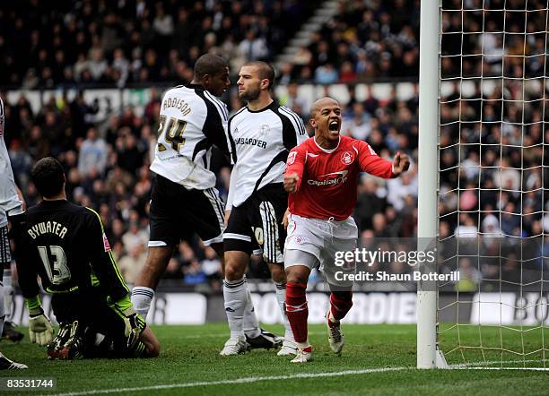 Robert Earnshaw of Nottingham Forest celebrates after Emanuel Villa of Derby County scores a home goal during Coca-Cola Championship match between...
