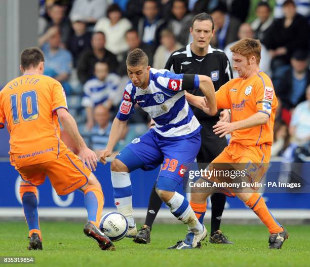 S Adel Taarabt in action with Sheffield Wednesday's Darren Potter and James O'Connor during the Coca-Cola Football Championship match at Loftus Road,...