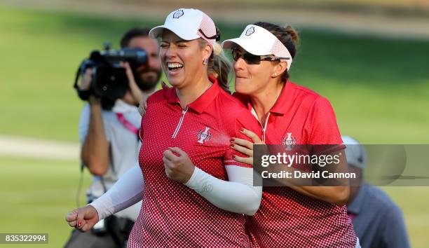 Brittany Lincicome and Brittany Lang of the United States Team celebrate after winning their match against Florentyna Parker and Caroline Masson of...