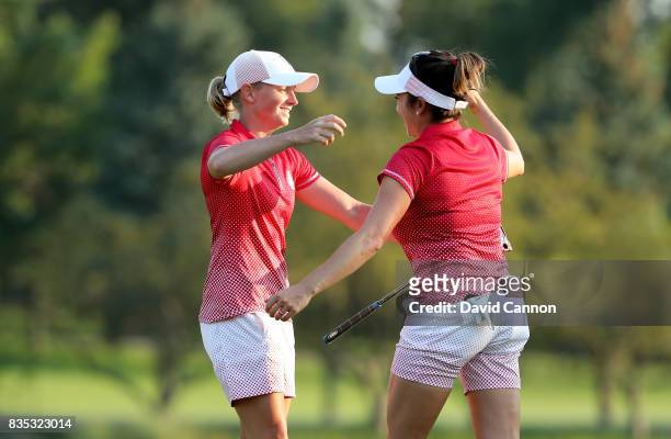Stacy Lewis of the United States celebrates holing the match winning putt for a birdie on the 17th hole in her match with Gerina Piller against...