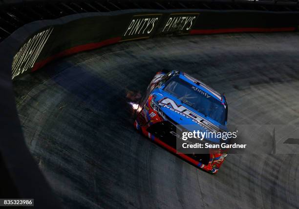 Kyle Busch, driver of the NOS Rowdy Toyota, leads a pack of cars during the NASCAR XFINITY Series Food City 300 at Bristol Motor Speedway on August...