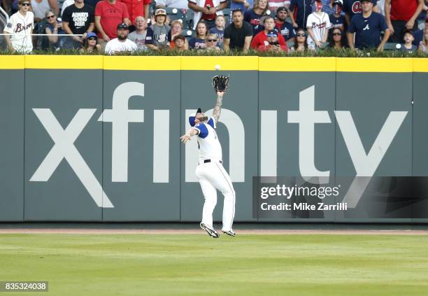 Left fielder Matt Adams of the Atlanta Braves makes a running catch in the first inning during the game against the Cincinnati Reds at SunTrust Park...