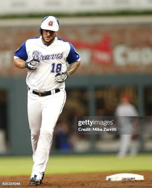 Left fielder Matt Adams of the Atlanta Braves runs past second base after hitting a solo home run in the second inning during the game against the...