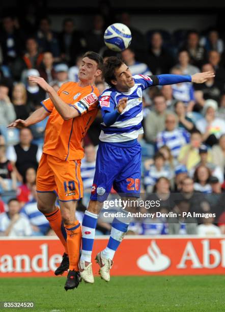 Sheffield Wednesday's Darren Potter and Queens Park rangers' Jordi Lopez battle for a ball in the air during the Coca-Cola Football Championship...
