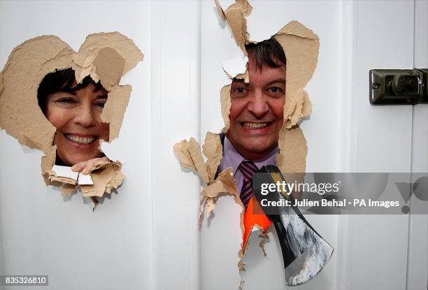 Green Euro Candidate Deirdre de Burca with Fianna Fail MEP Eoin Ryan peering through a smashed door that illustrates the smashing down of information...
