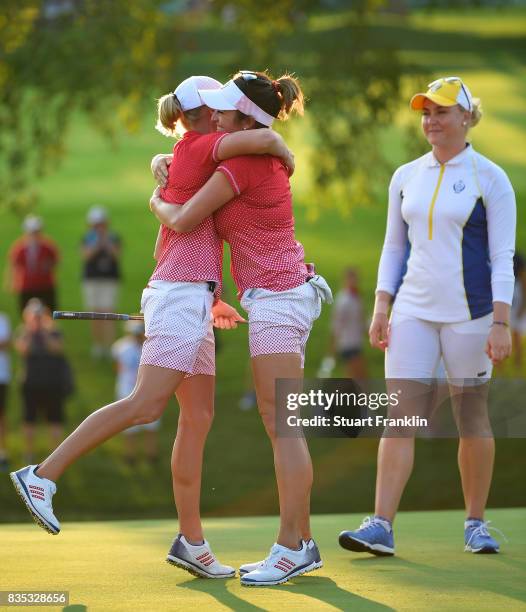 Stacy Lewis of Team USA celebrates holeing the winning putt on the 17th hole with playing partner Gerina Piller during the afternoon fourball matches...