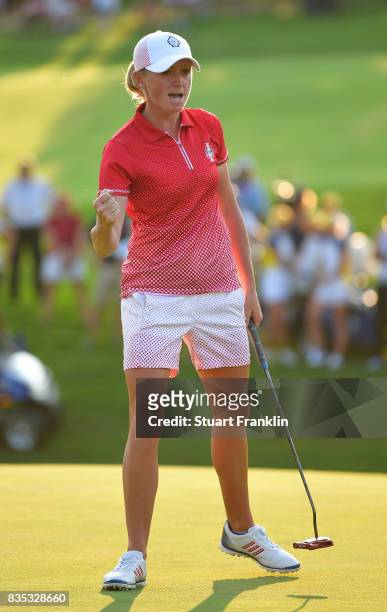 Stacy Lewis of Team USA celebrates holeing the winning putt on the 17th hole during the afternoon fourball matches of The Solheim Cup at Des Moines...