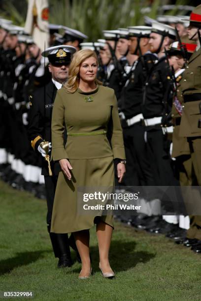 Croatian President Kolinda Grabar-Kitarovicon inspects a guard of honour at Government House August 19, 2017 in Auckland, New Zealand. President...