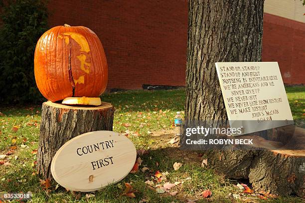 Pumpkin carved with the image of Republican presidential candidate John McCain sits near the entrance of Strath Haven High School in Wallingford,...