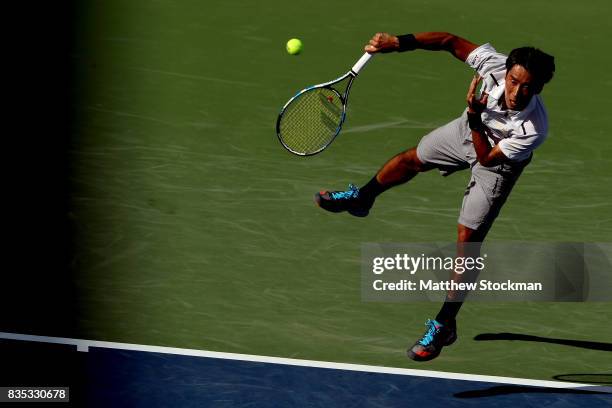 Yuichi Sugita of Japan serves to Grigor Dimitrov of Bulgaria during day 7 of the Western & Southern Open at the Lindner Family Tennis Center on...