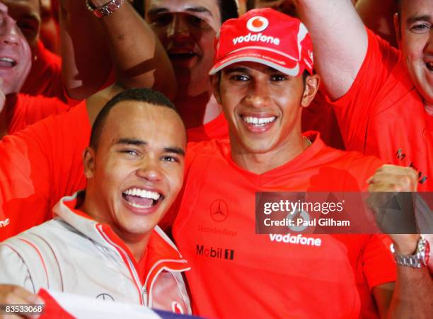 New Formula One World Champion Lewis Hamilton of Great Britain and McLaren Mercedes celebrates with his half-brother Nick Hamilton following the...