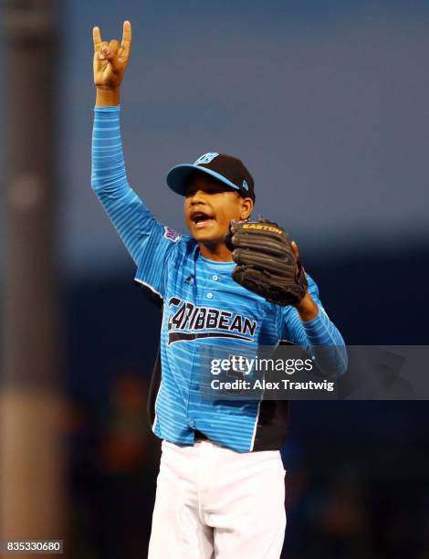 Erick Torres of the Dominican Team from Los Bravos de Pontezuela signals two out during Game 7 of the 2017 Little League World Series against the...