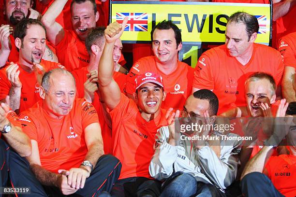 New Formula One World Champion Lewis Hamilton of Great Britain and McLaren Mercedes celebrates with his half-brother Nick Hamilton and his Team...