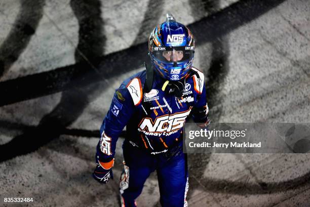 Kyle Busch, driver of the NOS Rowdy Toyota, celebrates after winning the NASCAR XFINITY Series Food City 300 at Bristol Motor Speedway on August 18,...