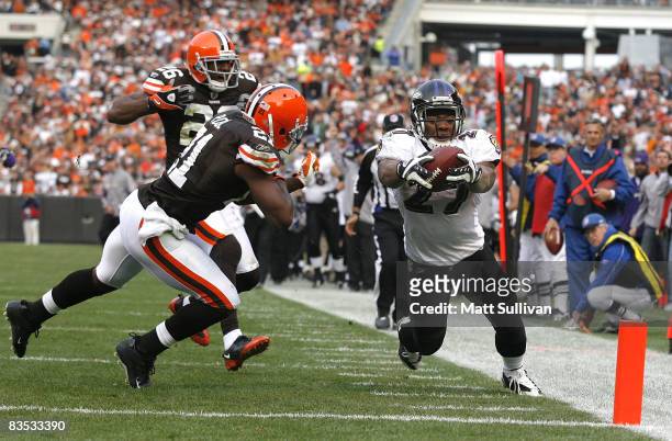 Ray Rice of the Baltimore Ravens steps out of bounds before being hit by Brodney Pool of the Cleveland Browns during the third quarter of their NFL...