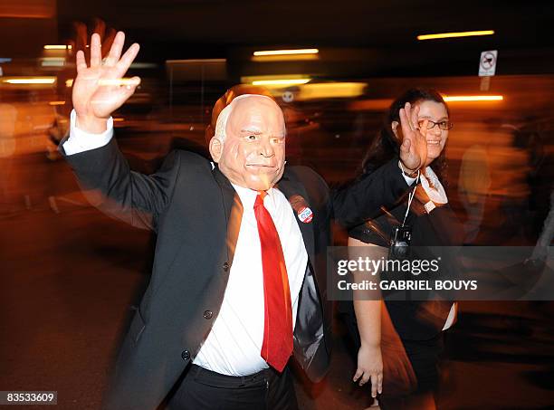 Man wearing a mask of Republican presidential candidate John McCain and a Sarah Palin look-a-like attend the West Hollywood Halloween costume...