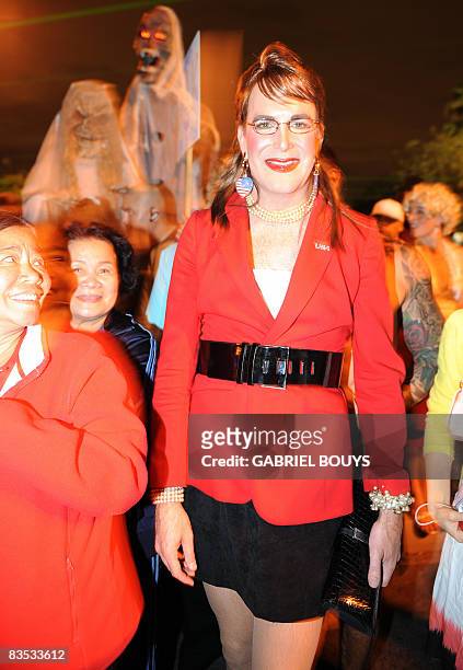 Man dresses like Republican US vice presidential candidate Sarah Palin attends the West Hollywood Halloween costume carnival, in West Hollywood,...