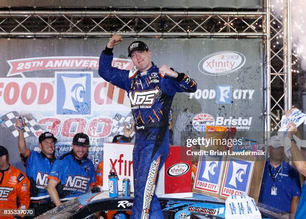 Kyle Busch, driver of the NOS Rowdy Toyota, celebrates in victory lane after winning the NASCAR XFINITY Series Food City 300 at Bristol Motor...