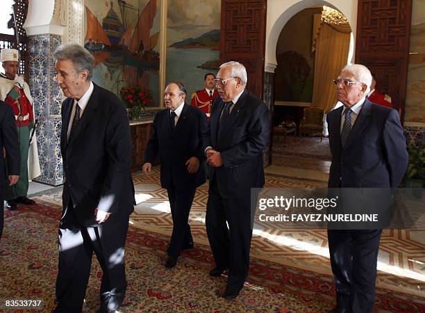 Algerian President Abdelazziz Bouteflika escorts former state Presidents Ahmed Ben Bella , Ali Hussain Kafi and Chadli Bendjedid during a reception...