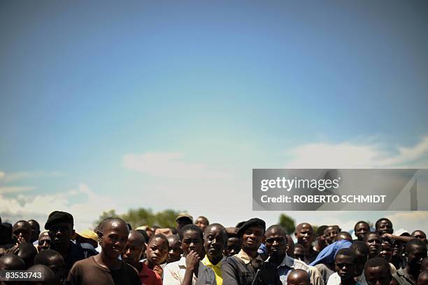 Residents of the town of Ruthshuru acknowledge a local leader at the local stadium on November 1, 2008 in Rutshuru in a ceremony where a new local...