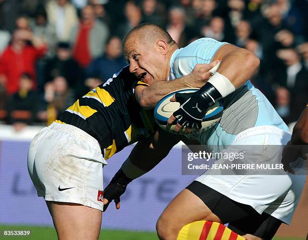 Mont-de-Marsan's hooker Marius Tincu vies with a Perpignan's player, during their French Top 14 rugby Union match Mont-de-Marsan vs Perpignan, on...