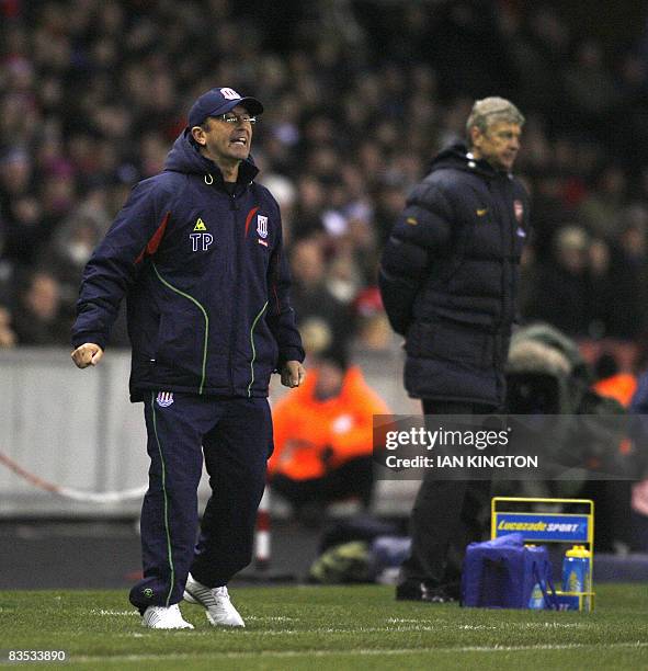 Manager of Stoke City Tony Pulis and French Arsene Wenger, manager of Arsenal during the match are pictured during a Premier League game at the...