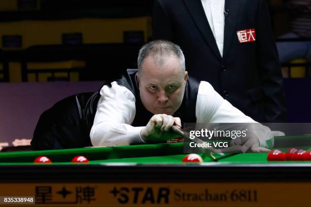 John Higgins of Scotland plays a shot during his second round match against Tom Ford of England on day three of Evergrande 2017 World Snooker China...