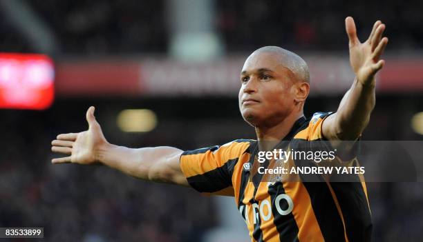 Hull City's French-Gabonese forward Daniel Cousin celebrates after scoring during the English Premier league football match against Manchester United...