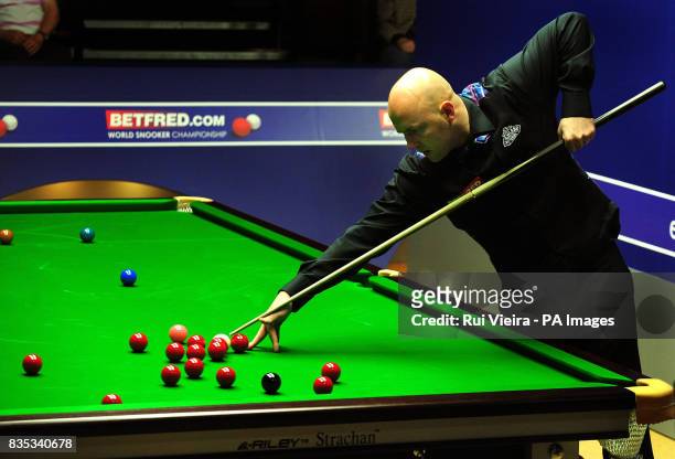 England's Mark King in action against England's Rory McLeod during the Betfred.com World Snooker Championship at The Crucible Theatre, Sheffield.