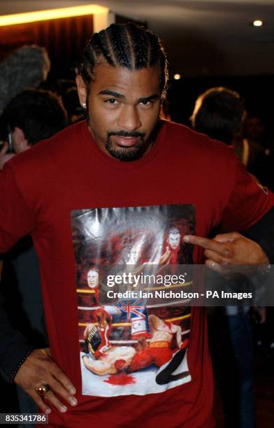 David Haye shows a T-shirt portraying him beheading Ukranian boxing brothers Wladimir and Vitali Klitschko during a press conference at The Hospital,...