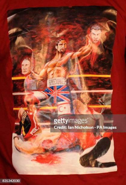 David Haye wears a T-shirt portraying him beheading Ukranian boxing brothers Wladimir and Vitali Klitschko during a press conference at The Hospital,...