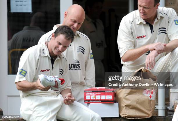 Andrew Strauss shows off a new pair of boots with David Nash and Shaun Udal during a Media Day at Lord's Cricket Ground, London.