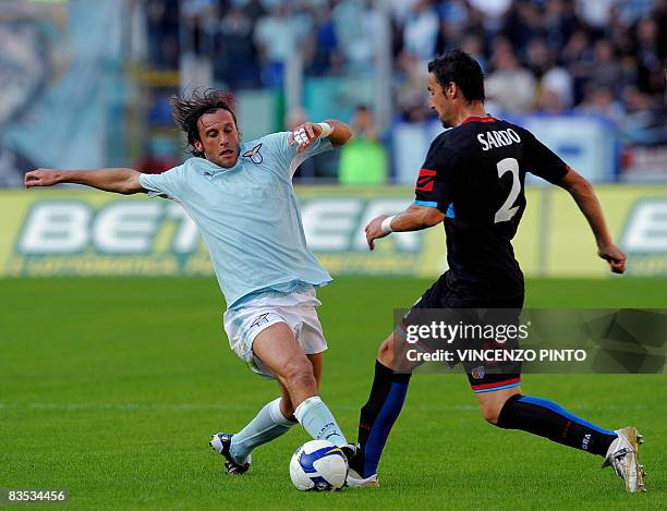 Lazio's midfielder Stefano Mauri fights for the ball with Catania's defender Gennaro Sardo during their Serie A football match at Olympic stadium in...